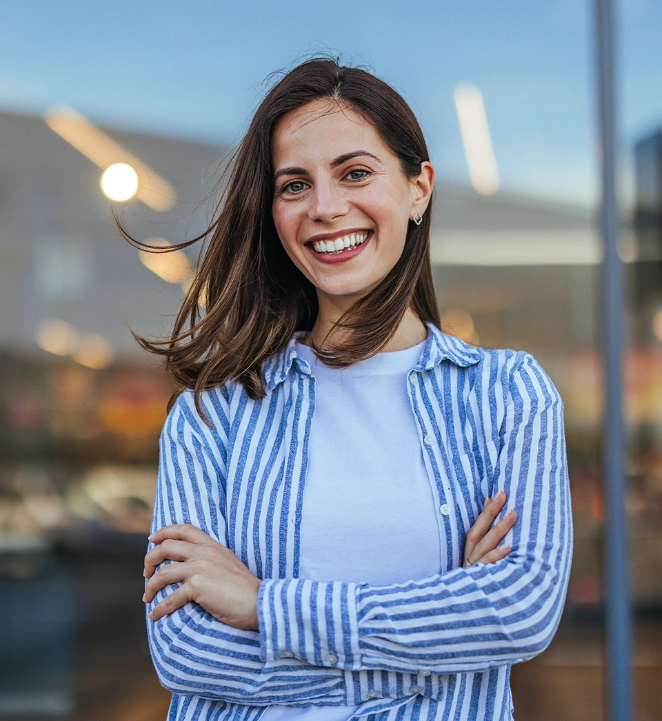 Smiling woman with arms crossed – online psychiatry in Clovis, NM